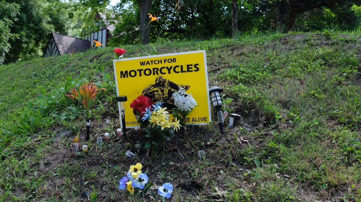A memorial was created near Scott Avenue and Winner Road in Independence after two innocent bystanders were struck and killed by a driver fleeing from Independence police officers in March.