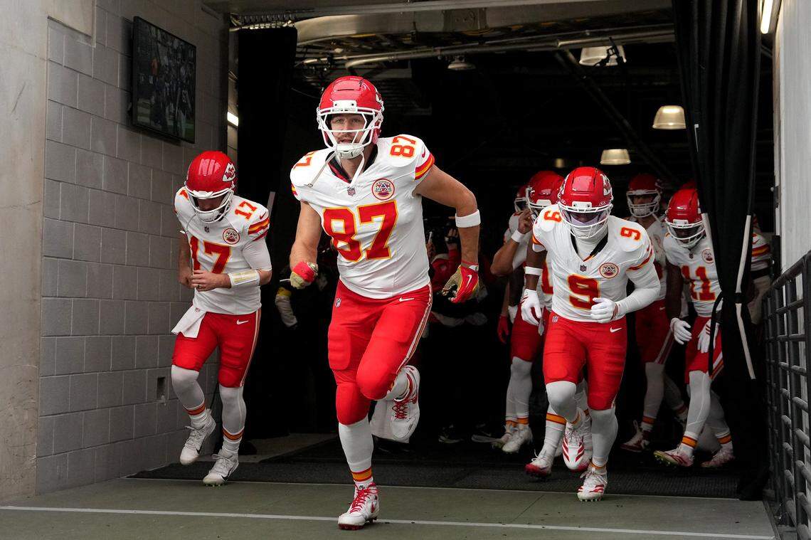 Tight end Travis Kelce leads the Kansas City Chiefs onto the field at Allegiant Stadium in Las Vegas for an NFL Week 18 game against the Raiders.