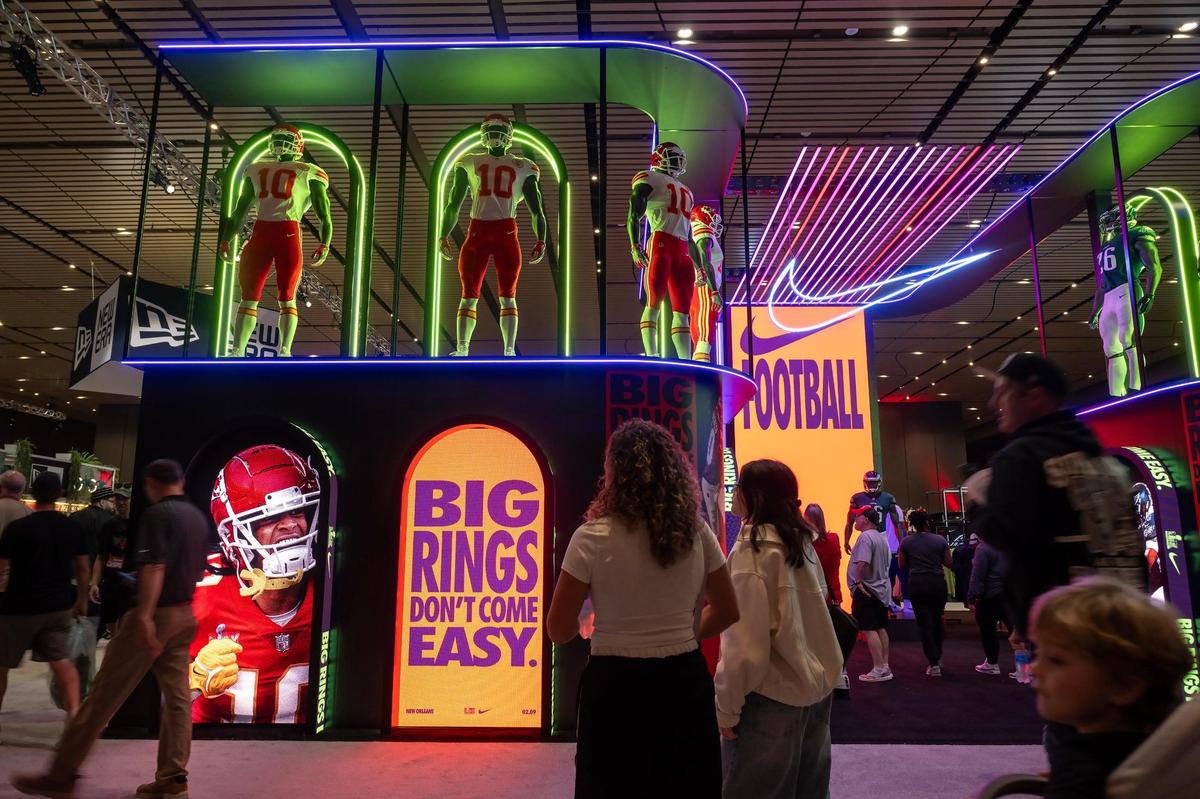 Visitors strolled through the NFL Shop during a visit to the Super Bowl Experience at the Ernest N. Morial Convention Center on Thursday, Feb. 6, 2025, in New Orleans. The area featured a display on Kansas City Chiefs running back Isiah Pacheco.