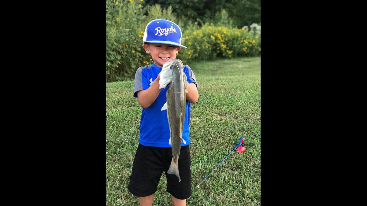 Three-year-old Nixon Lovan shows off the nice largemouth bass he caught all by himself for the first time. The fish was landed on a green pumpkin Ned rig.