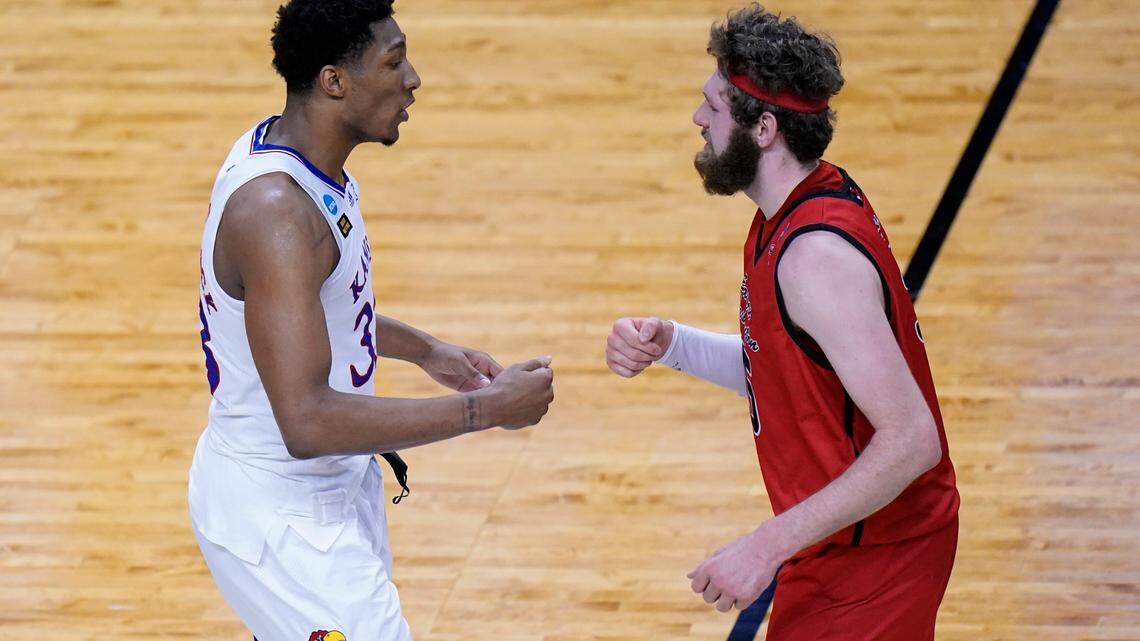 Kansas forward David McCormack (33) greetsEastern Washington forward Tanner Groves (35) after Kansas won a first-round game in the NCAA college basketball tournament at Farmers Coliseum in Indianapolis, Saturday, March 20, 2021. (AP Photo/AJ Mast)