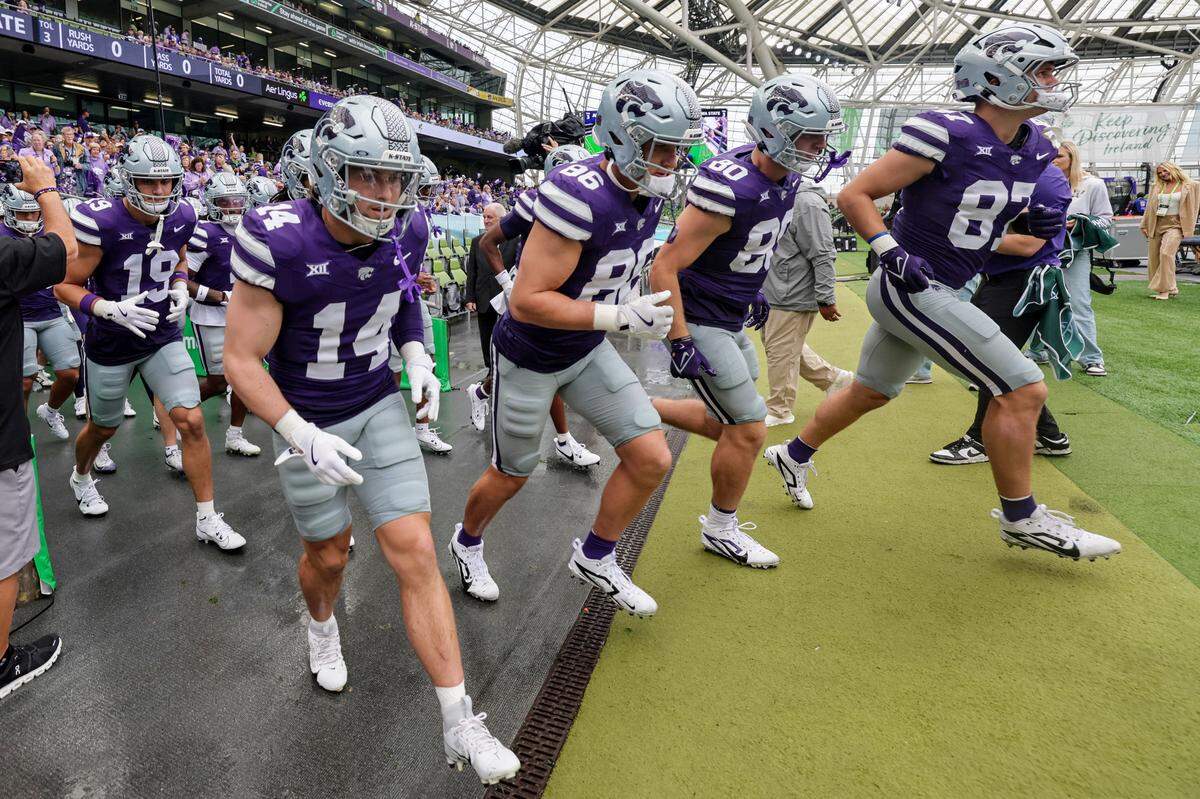 Kansas State players head to the field for the Aer Lingus Classic between Iowa State and Kansas State at Aviva Stadium in Dublin on Aug. 23, 2025.