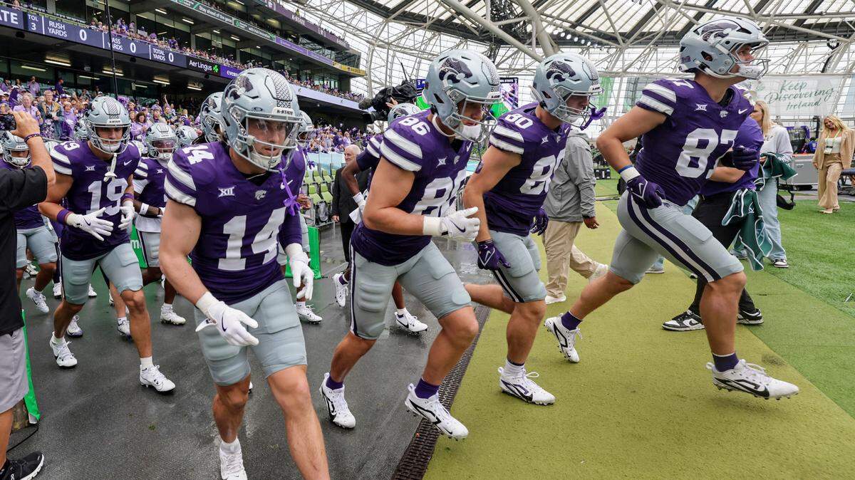 Kansas State players head to the field for the Aer Lingus Classic between Iowa State and Kansas State at Aviva Stadium in Dublin on Aug. 23, 2025.