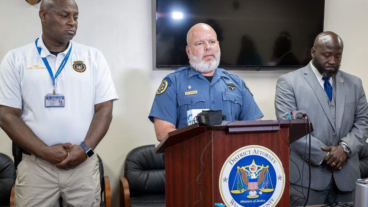 Wyandotte County Sheriff Daniel Soptic, center, spoke at a news conference in Kansas City, Kansas, on Tuesday, July 29, 2025, where he addressed the loss of Deputy Elijah Ming, who was fatally shot on July 26, 2025. The conference announced the filing of charges against Shawn Harris in connection with the shooting. Among others, Soptic was joined by Chief of Police Karl A. Oakman, left, of the Kansas City, Kansas Police Department, and District Attorney Mark A. Dupree Sr.