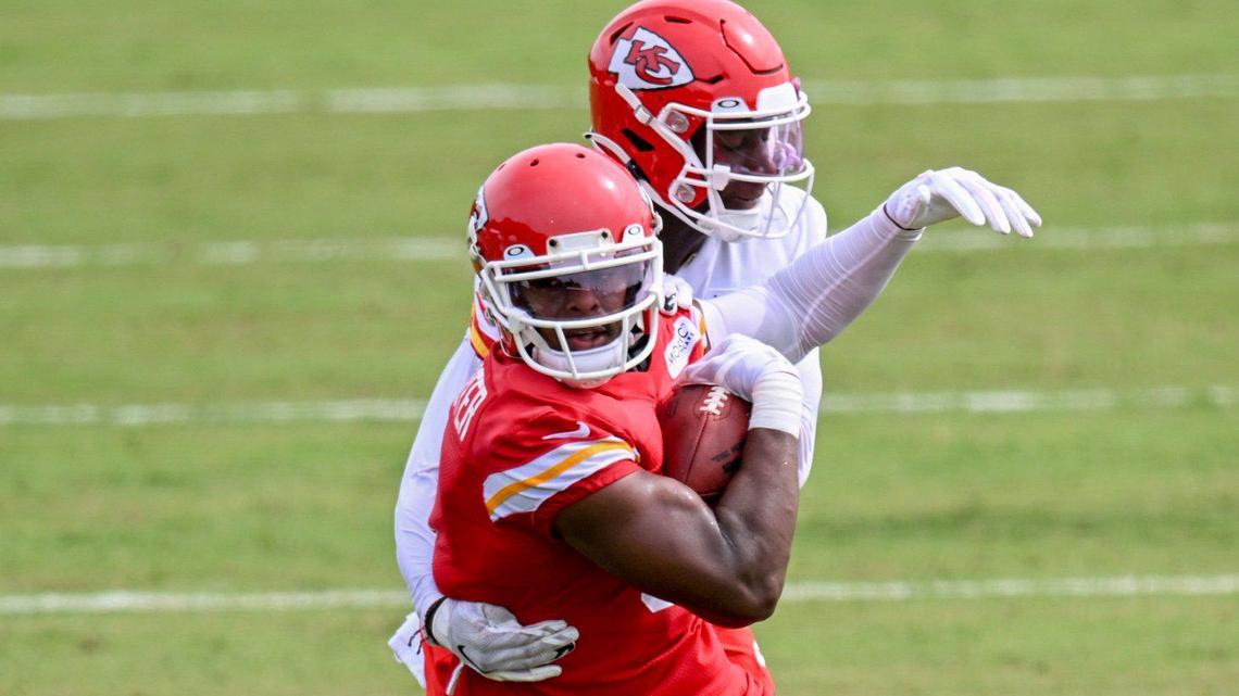 Chiefs wide receiver JuJu Smith-Schuster (9) gets grabbed by cornerback Joshua Williams (23) during training camp on Friday, July 29, 2022 at Missouri Western State University, in St. Joseph, Missouri.