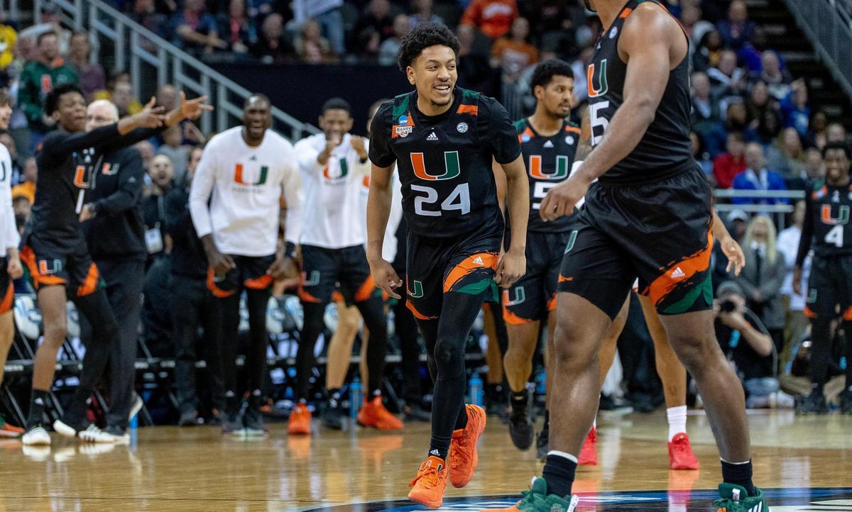 Miami guard Nijel Pack (24) celebrates a 3-pointer against Houston during a Sweet 16 game in the Midwest Regional of the NCAA Tournament Friday, March 24, 2023, in Kansas City.