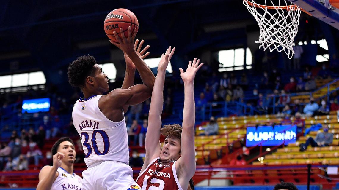 KU’s Ochai Agbaji elevates over OU’s Austin Reaves on Saturday at Allen Fieldhouse (Jan. 9, 2021). KU beat OU 63-59.