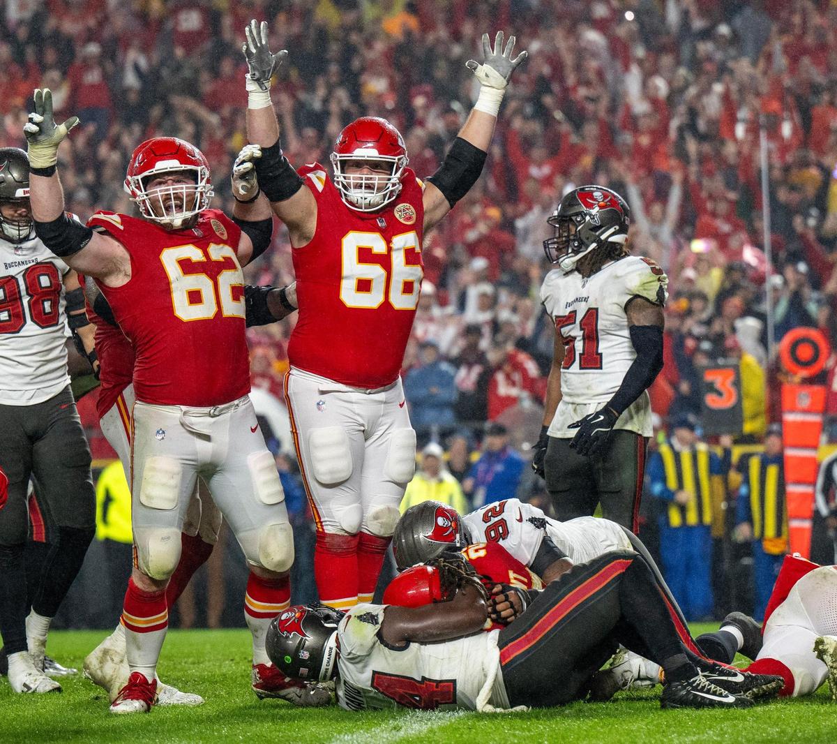 Kansas City Chiefs guards Joe Thuney (62) and Mike Caliendo (66) cheer as running back Kareem Hunt (29) scores the game-winning touchdown in overtime, securing a 30-24 victory over the Tampa Bay Buccaneers on Monday, Nov. 4, 2024, at GEHA Field at Arrowhead Stadium.