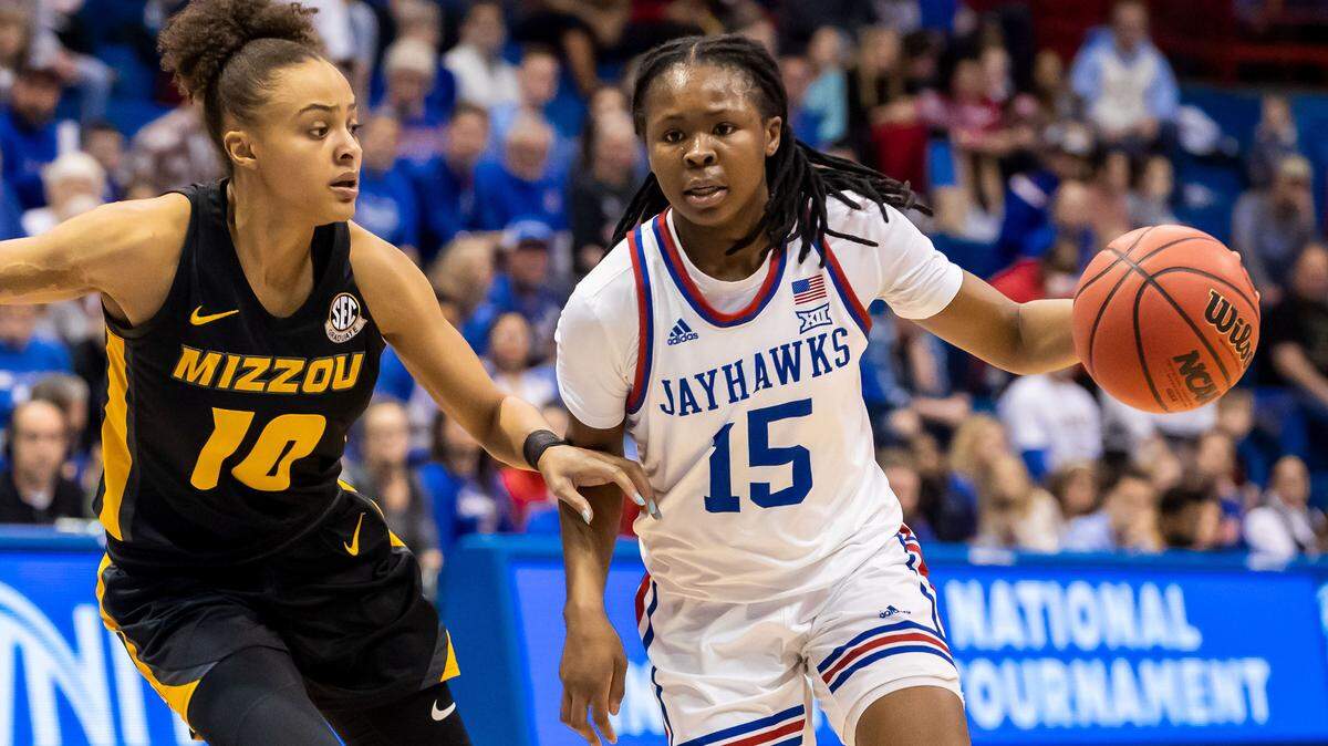 Kansas guard Zakiyah Franklin (15) maneuvers past Missouri guard Katlyn Gilbert (10) during the second round of the Women’s NIT game between the Kansas Jayhawks and Missouri Tigers on Saturday March 20, 2023 at Allen Field house in Lawrence, Kansas.