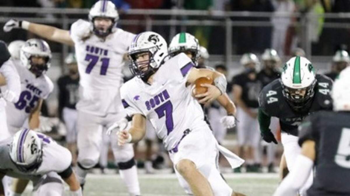 Park Hill South quarterback Briggs Bartosh runs through the Staley defense during the Panthers’ 50-40 win Friday night at Staley High School.