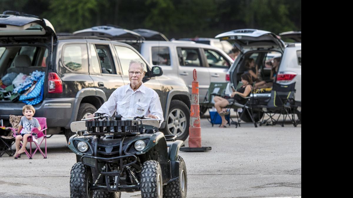 Wes Neal, longtime owner of the Boulevard Drive-in in Kansas City, Kansas, roams the grounds on his ATV in 2015.