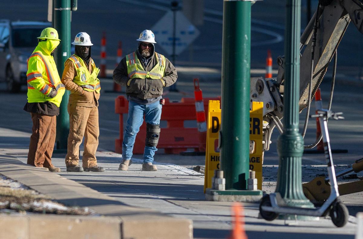 One day after temperatures hit the mid-70s, construction workers were bundled against the bitter cold Wednesday as their work continued on the KC Streetcar expansion along Main Street near Pershing Road in Kansas City
