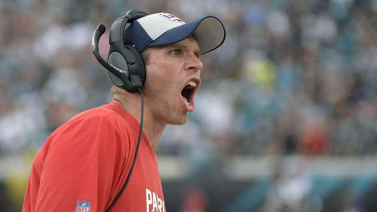 New England Patriots defensive line coach Brendan Daly, left, shouts out instructions on the sideline during the second half of an NFL football game against the Jacksonville Jaguars Sunday, Sept. 16, 2018, in Jacksonville, Fla. The Jaguars won 31-20. (AP Photo/Phelan M. Ebenhack)