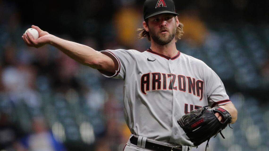 Arizona Diamondbacks’ Matt Peacock throws to first after fielding a bunt during the fourth inning of a baseball game against the Milwaukee Brewers Friday, June 4, 2021, in Milwaukee. (AP Photo/Aaron Gash)