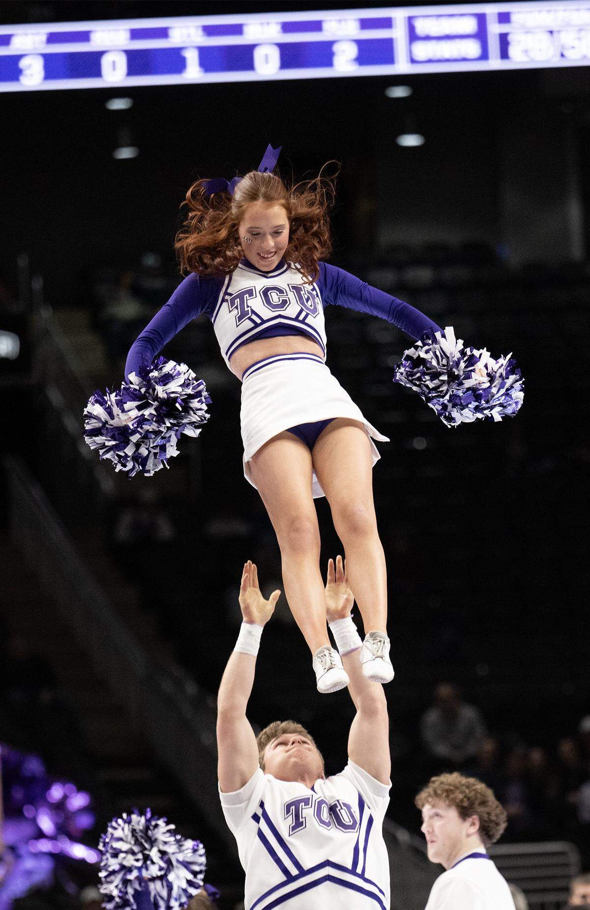 Texas Christian University Horned Frogs cheerleaders perform during the second half of the game against the Oklahoma State Cowboys during the Big 12 Men's Basketball Tournament at T-Mobile Center on Wednesday, March 11, 2026, in Kansas City. TCU defeated OSU, 95-88.