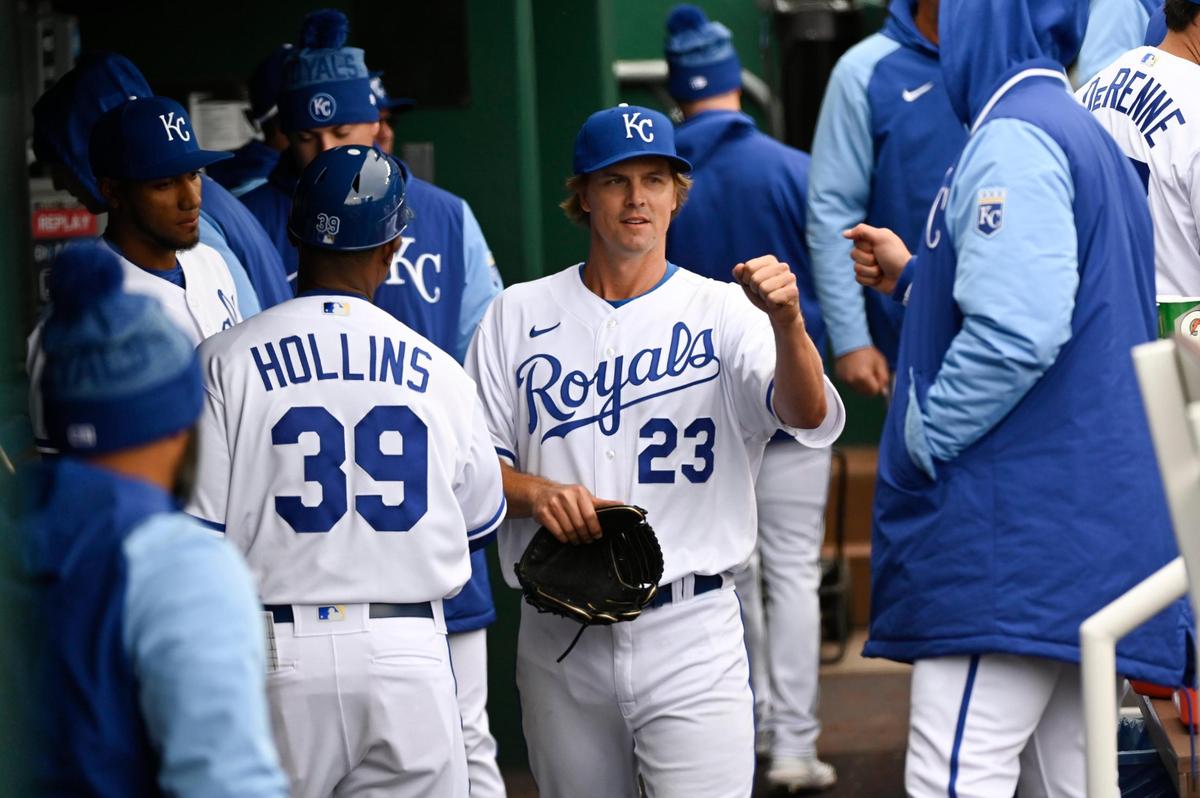Royals pitcher Zack Greinke (23) is congratulated after starting and giving up a single run in KC’s season opener against the Cleveland Guardians on Thursday at The K.