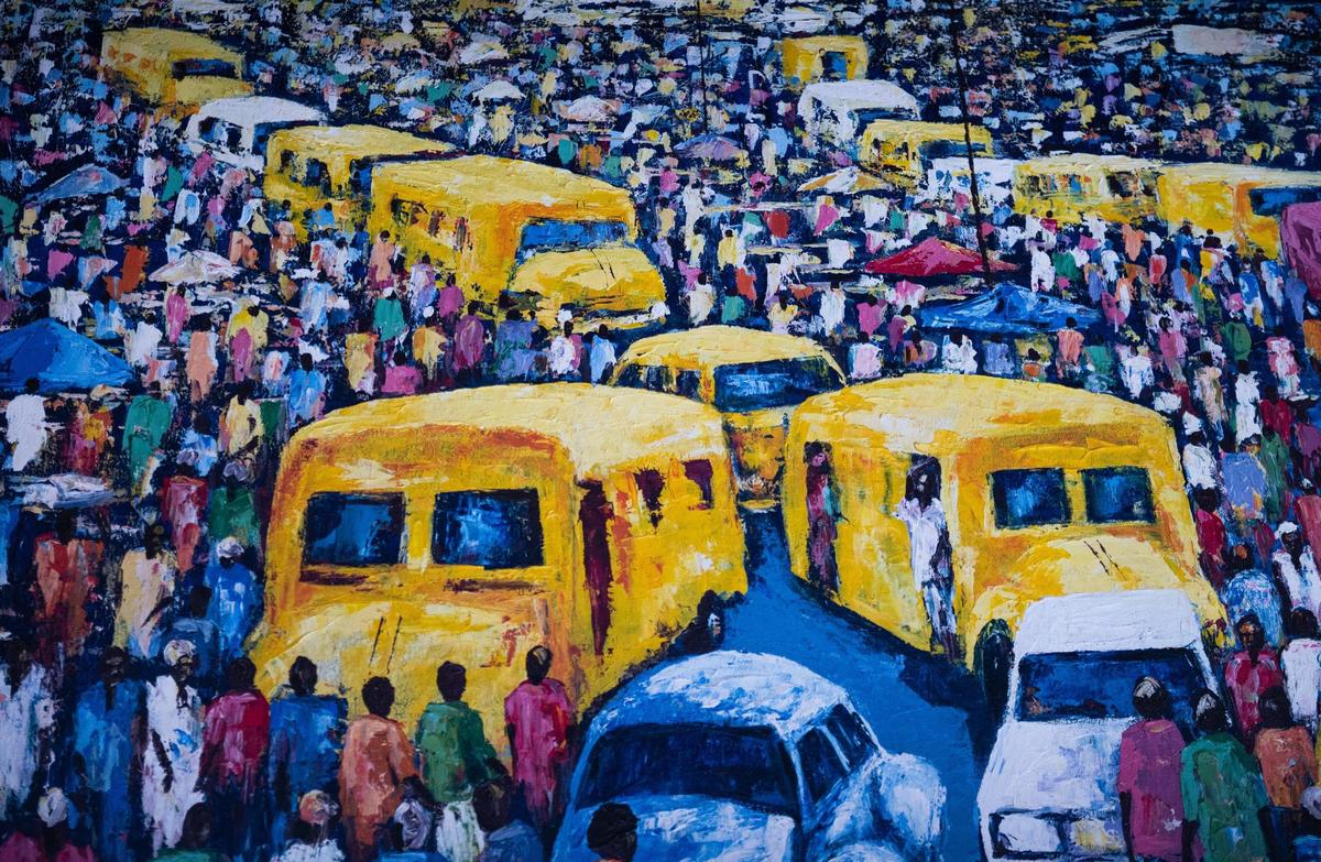 A painting of a crowded bus stop in Lagos, Nigeria, hangs on the wall of My Village Grilll. Owner and chef Victor Chukwudi Ejelonu is from Lagos and specializes in cooking West African cuisine.
