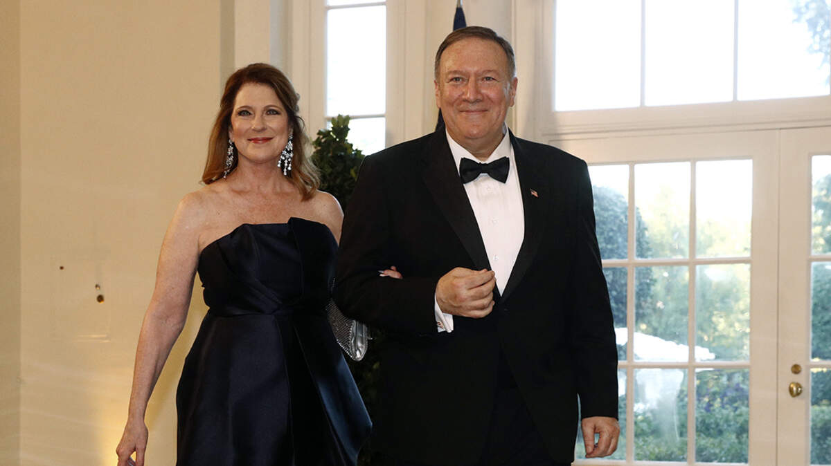 Secretary of State Mike Pompeo, right, and wife Susan Pompeo arrive for a State Dinner with Australian Prime Minister Scott Morrison and President Donald Trump at the White House, Friday, Sept. 20, 2019, in Washington. (AP Photo/Patrick Semansky)