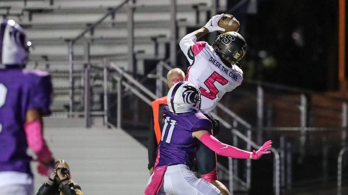 Lee’s Summit’s Joshua Manning makes a catch for a first down over Park Hill South’s Chase Fitch during a game a few weeks ago.