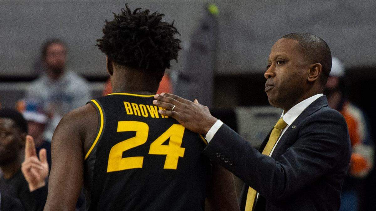 Missouri head coach Dennis Gates greets Kobe Brown (24) on the sideline as the Auburn Tigers take on Missouri at Neville Arena in Auburn, Ala., on Tuesday, Feb. 14, 2023.