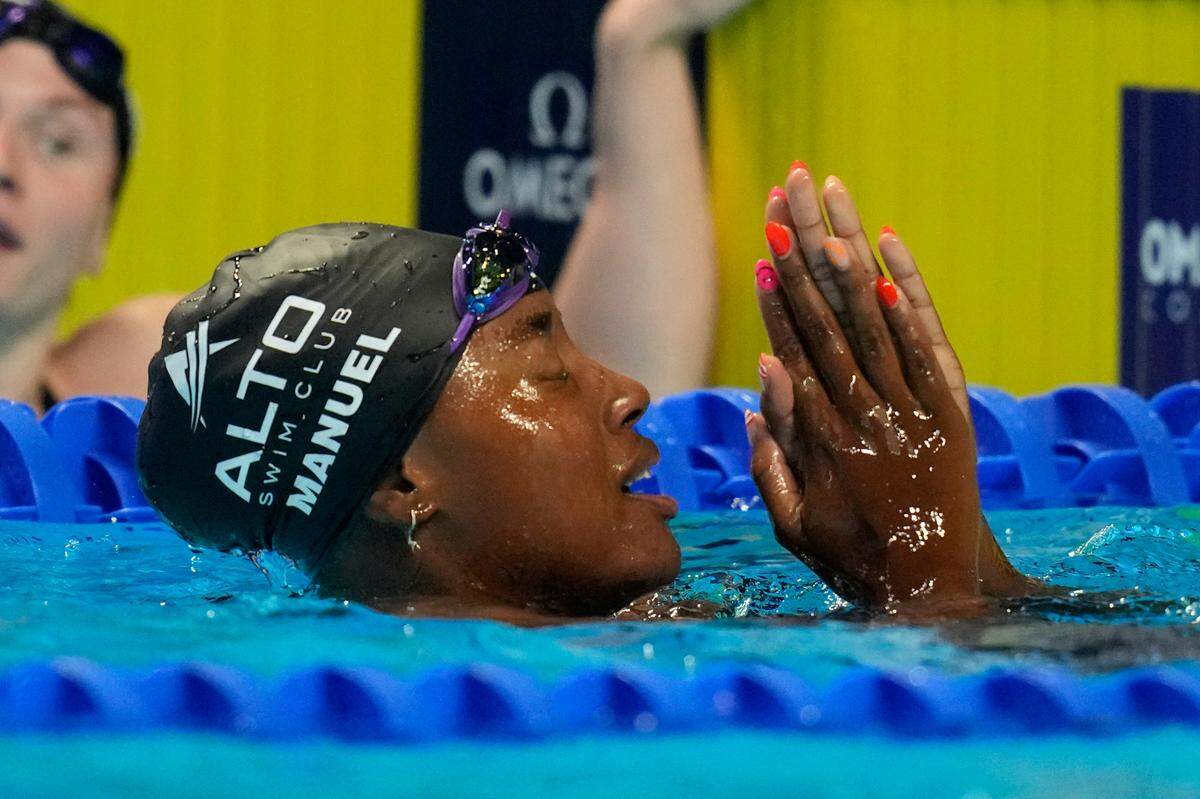 Simone Manuel reacts after winning the women’s 50-meter freestyle final during wave 2 of the U.S. Olympic Swim Trials on Sunday, June 20, 2021, in Omaha, Neb.