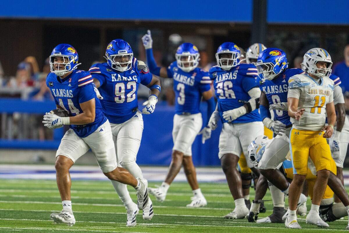 Kansas Jayhawks defensive end David Santiago (44) runs with the football after stripping it from a Long Island University player in the second half of the Jayhawks game vs. Long Island University Sharks at David Booth Memorial Stadium on Friday, September 4, 2026, in Lawrence.