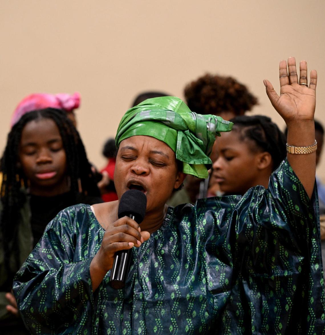 Byaunda Alengamina, center, and her husband, choir founder John Wilondja, are refugees from the Democratic Republic of the Congo. They fled that war-torn country for Tanzania, then were able to relocate to Florida. But jobs were more plentiful in Kansas City.