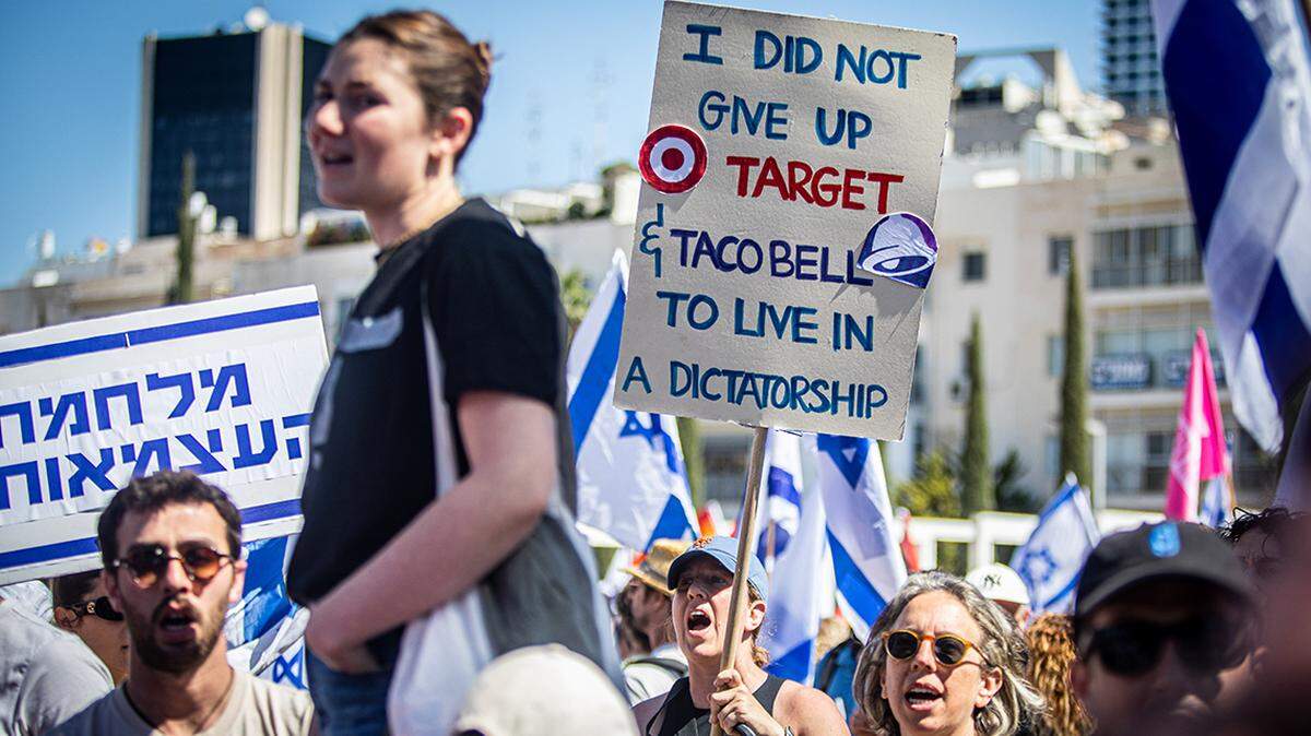 Demonstrators are using humorous posters and other techniques to educate the public about the threats to their freedom.