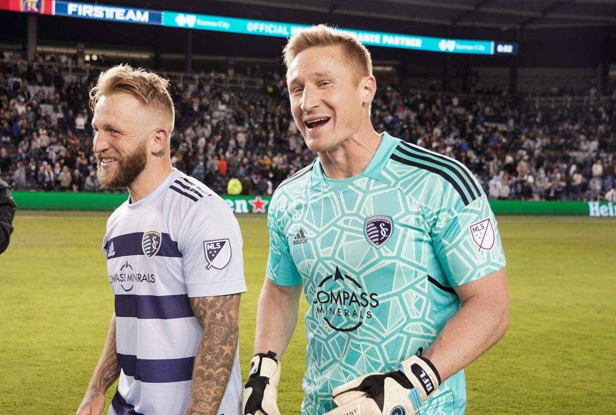 Sporting Kansas City forward Johnny Russell (7) and goalkeeper Tim Melia (29) after the win over Real Salt Lake at Children’s Mercy Park on March 26, 2022.