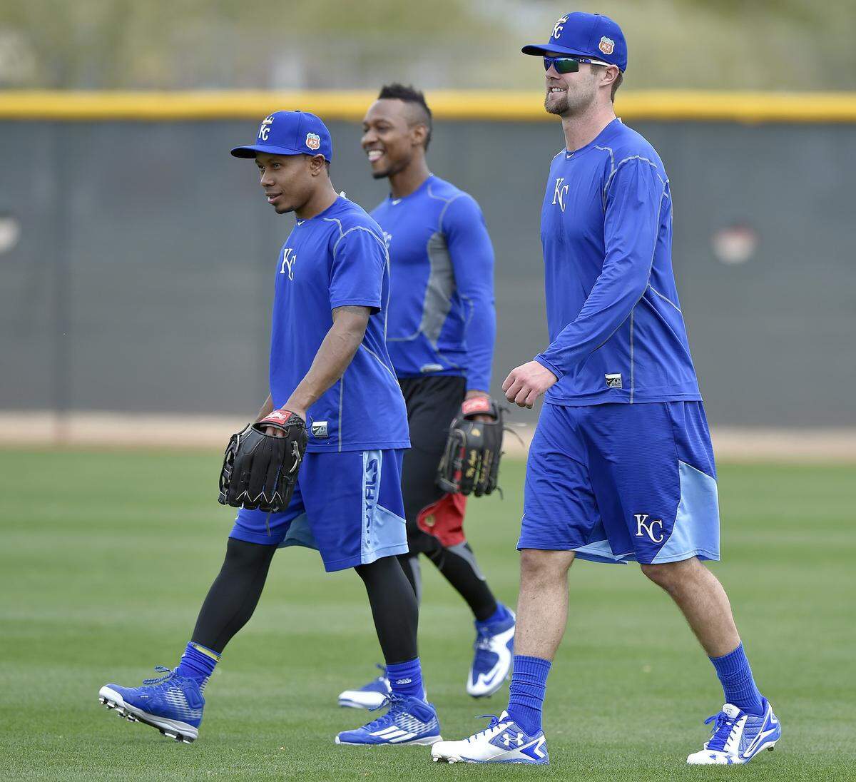 Kansas City Royals outfielder Terrance Gore, from left, Jarrod Dyson and Bubba Starling take the field for a February 2016 spring training workout in Surprise, Arizona.