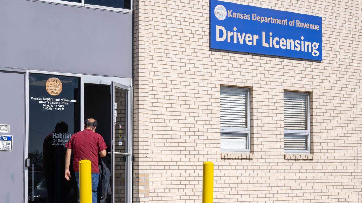 People walk into the Kansas Drivers License Department on 18th Street in Kansas City, Kansas, on Thursday, February 26, 2026.