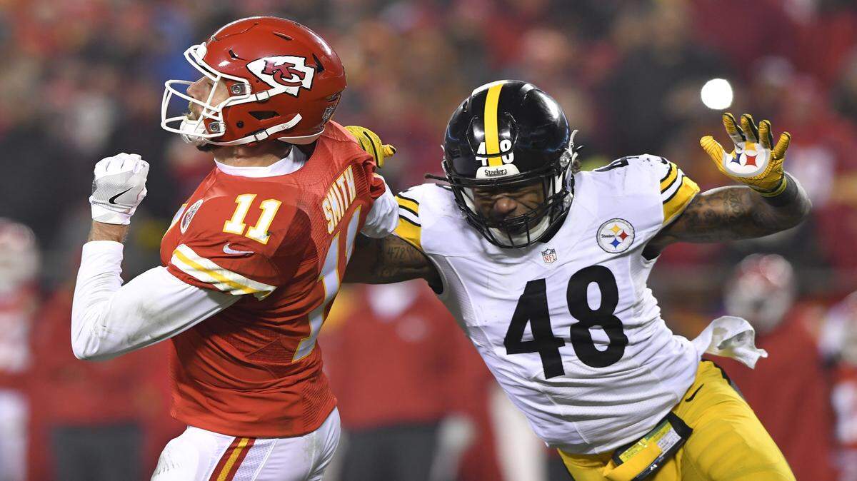 Pittsburgh Steelers outside linebacker Bud Dupree hit Kansas City Chiefs quarterback Alex Smith while Smith was attempting a pass in the second quarter during Sunday's AFC Divisional Playoff game between the Kansas City Chiefs and Pittsburgh Steelers at Arrowhead Stadium in Kansas City, Mo. Pittsburgh Steelers inside linebacker Ryan Shazier ended up intercepting the errant pass.