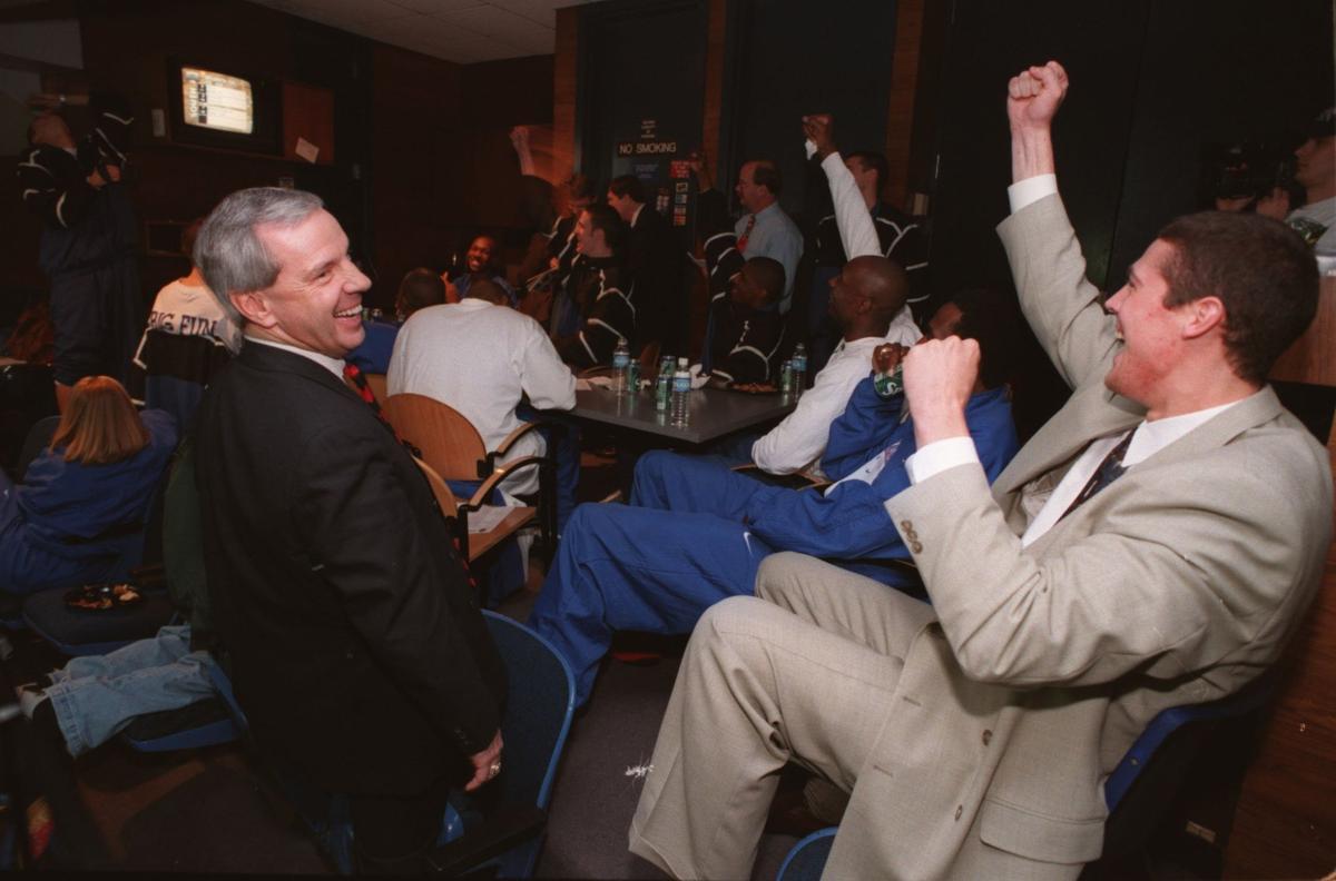 Kansas coach Roy Williams and senior Raef LaFrentz cheered an announcement during the 1998 selection show, but it wasn’t about KU. They were happy to see St. Louis selected because Troy Robertson, brother of KU guard Ryan Robertson, plays there.