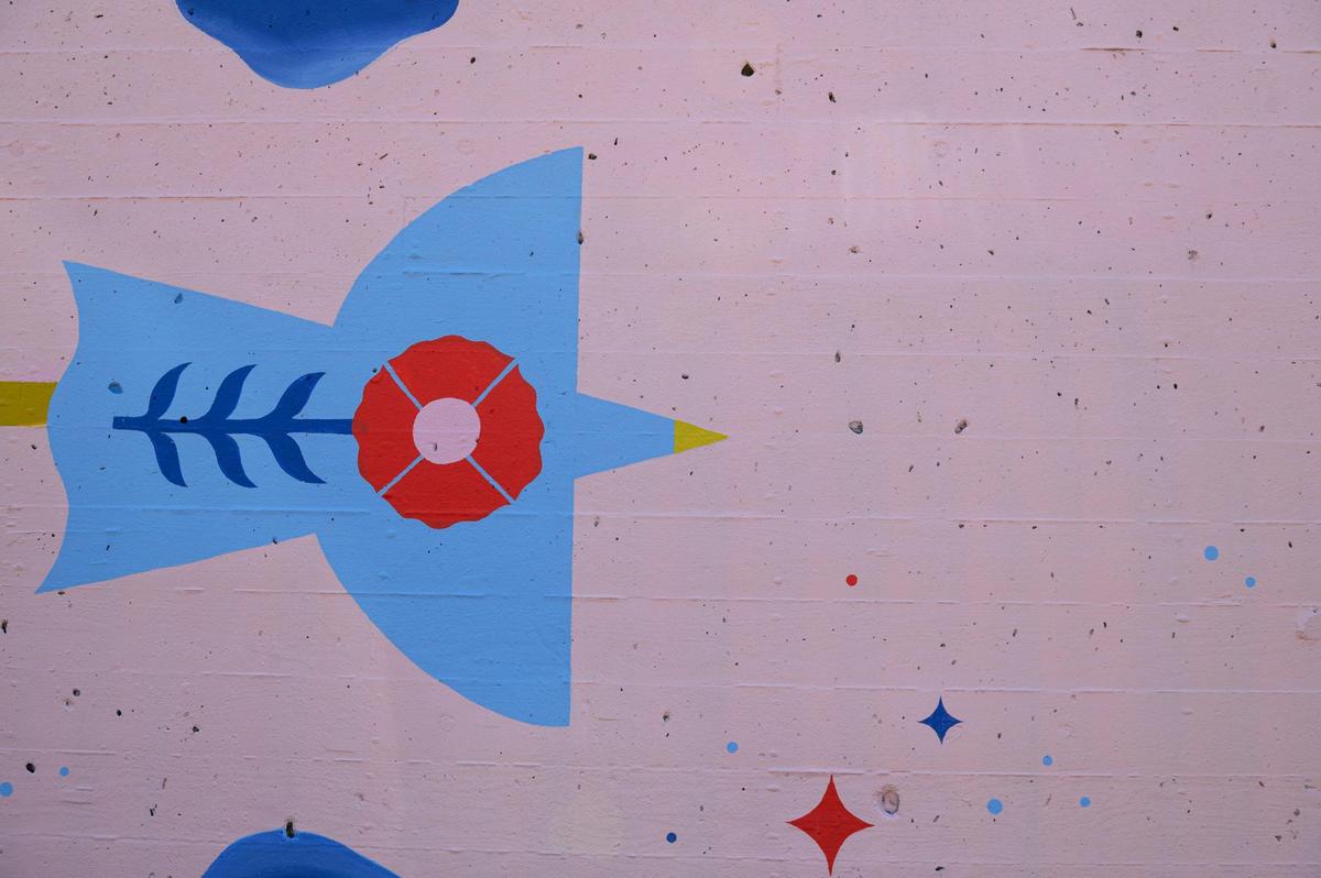 A detailed close up of Felicia Koloc’s mural “Joy Ride” is shown here on Friday, Sept. 15, 2023, at the Riverfront Heritage Trail in Kansas City. “Free spaces for the community are really hard to come by nowadays,” Koloc said. “I wanted to add something that was a little bit of a tribute to that.”