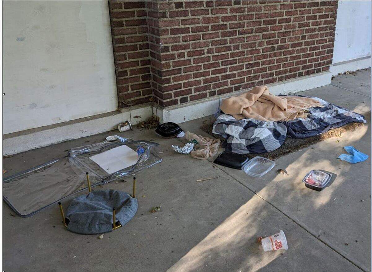 Blankets and trash suggest a trespasser has been sleeping outside the empty historic mansion at 4526 Warwick Blvd., in the Southmoreland neighborhood. The owners of the home want to demolish the structure, against neighbors’ wishes, for a possible commerical development.