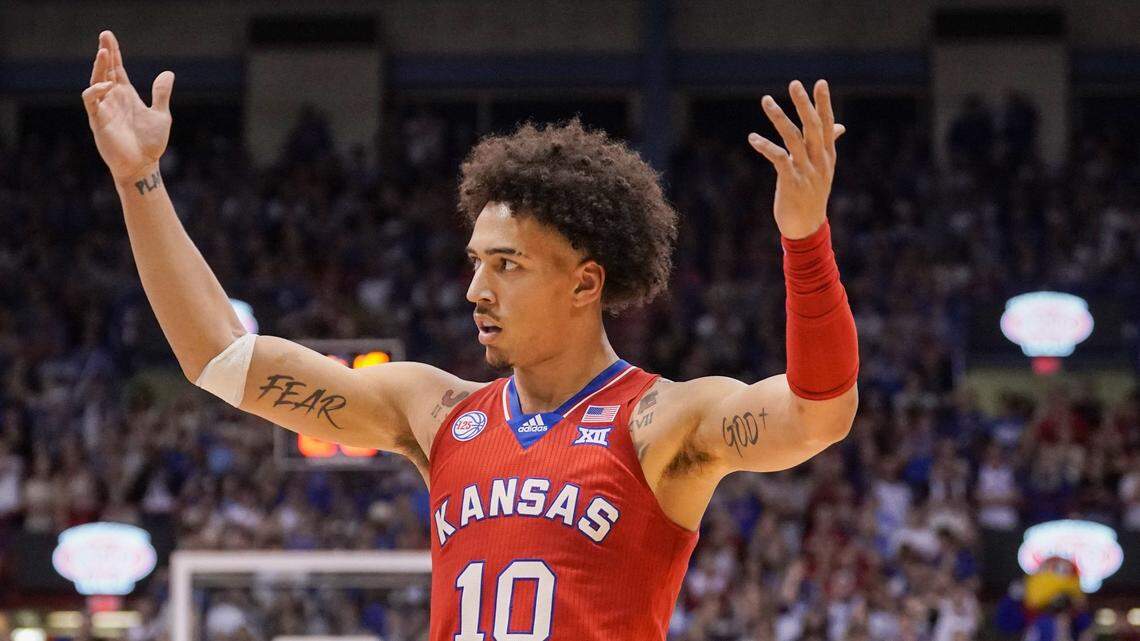 Kansas forward Jalen Wilson (10) celebrates with fans against the Texas Tech Red Raiders during senior night at Allen Fieldhouse on Feb. 28, 2023.