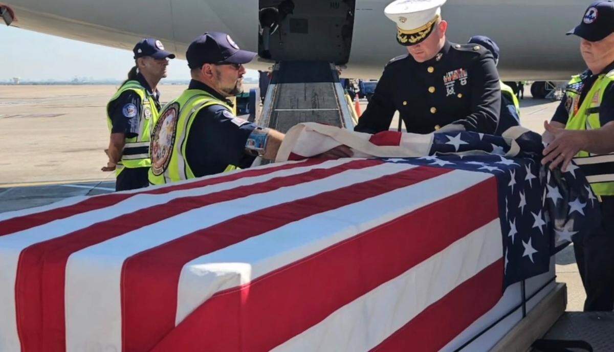 The flag-draped casket of Capt. Hall Stratton, killed in Korea in 1951, arrives at Kansas City International Airport.