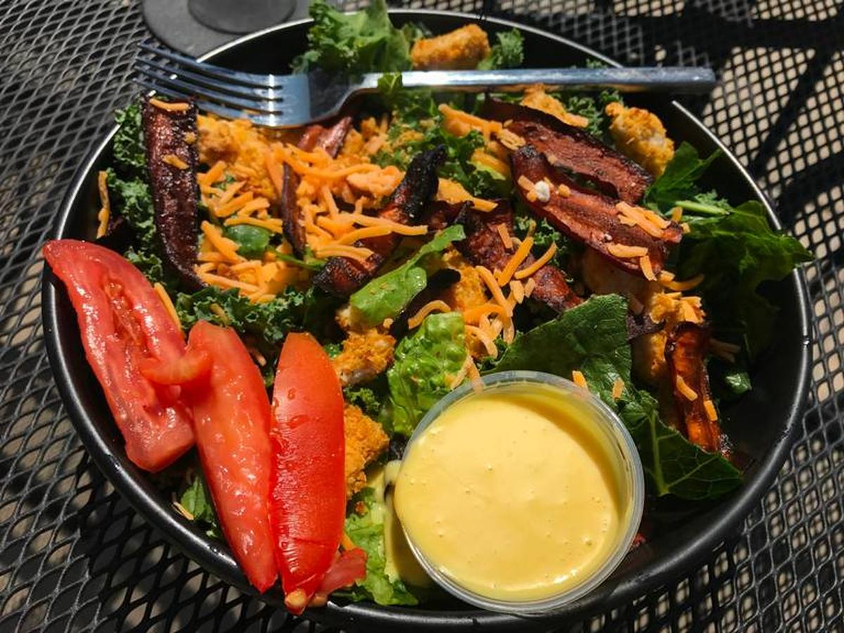 Cultivare’s crispy chicken BLT with a Romaine and kale blend and honey mustard dressing. 