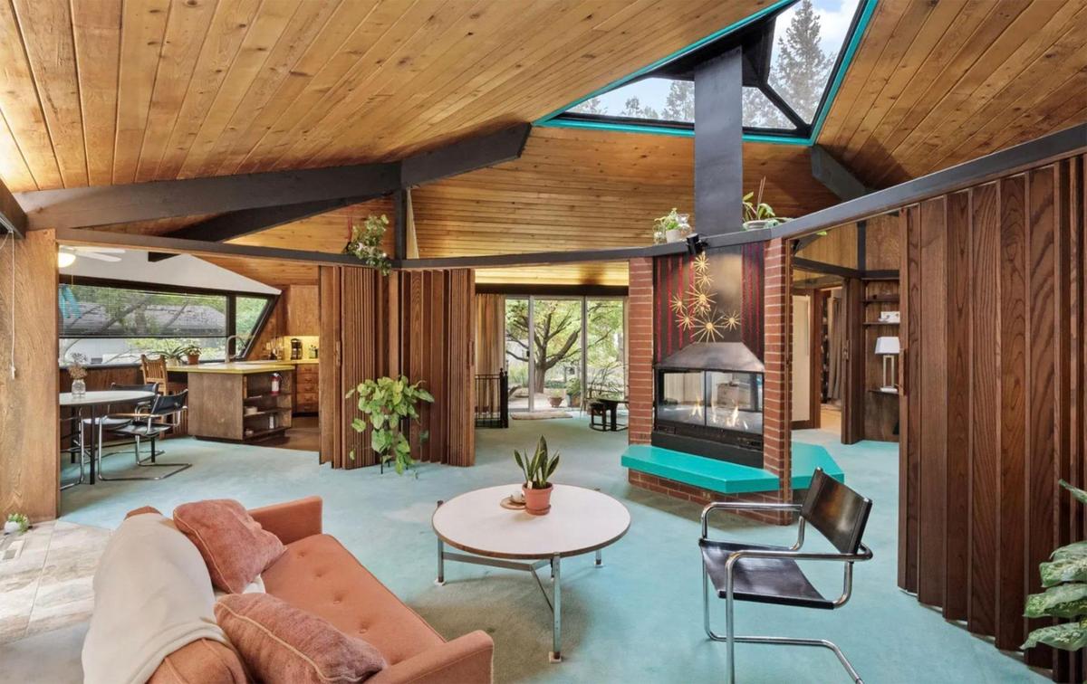 This real estate listing photo of Searing House shows the rooms staged with furniture.