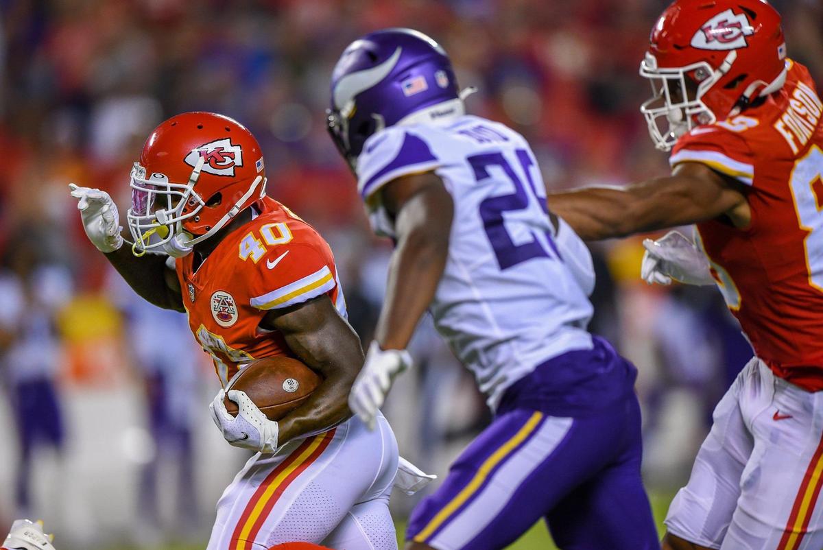 Kansas City Chiefs running back Derrick Gore (40) ran past Minnesota cornerback Alexander Mattison (25) for a touchdown during the second half against the Minnesota Vikings on Friday, Aug. 27, at Arrowhead Stadium in Kansas City.
