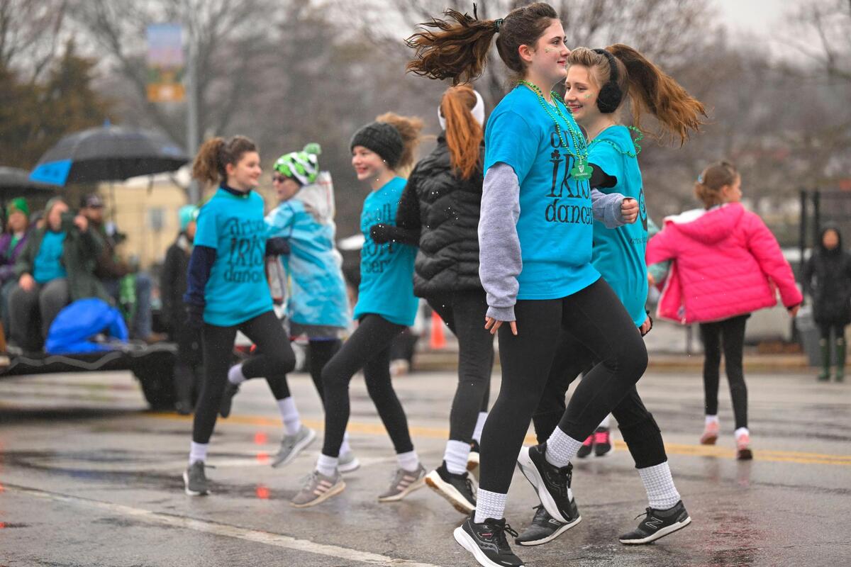 Driscoll Irish Dancers didn’t let wet streets and rain dampen the festivities as they danced in the street during the 2023 Brookside St. Patrick’s Day Warm-Up Parade on Saturday March 11, 2023 in Kansas City.