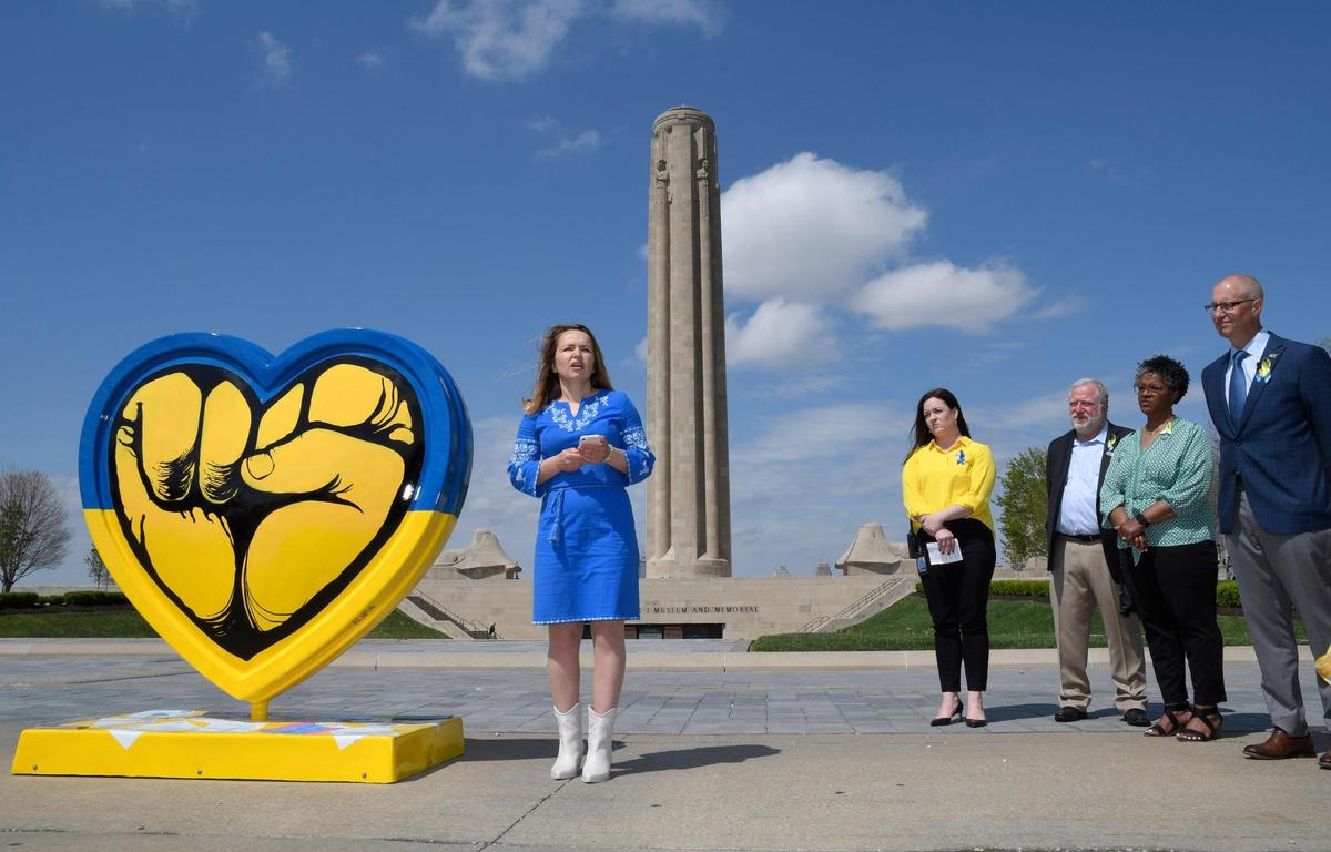 Lyuda Stewart of the Ukrainian Club of Kansas City spoke after the Parade of Hearts unveiled ‘We Are With You,” a heart in support of the Ukrainian people created by artist Jeremy Collins, of Kansas City, which was was unveiled April 28, 2022, at the National World War I Museum and Memorial.