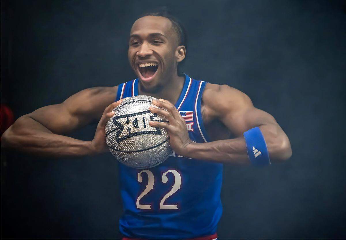 Shrouded in a light fog, Kansas Jayhawks Darryn Peterson, a freshman guard, has his photo taken during Big 12 Basketball Media Days at the T-Mobile Center on Wednesday, October 22, 2025, in Kansas City. Peterson was ranked as the No. 1 recruit at the beginning of the season, but has so far been plagued by injuries and missed several games. 