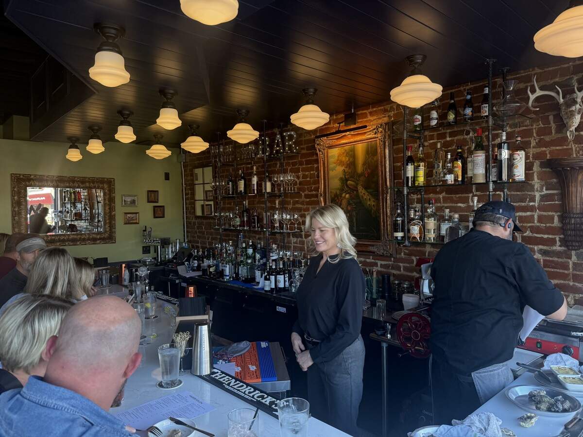 Customers at The Parker Hollow in downtown Parkville sit at the bar.