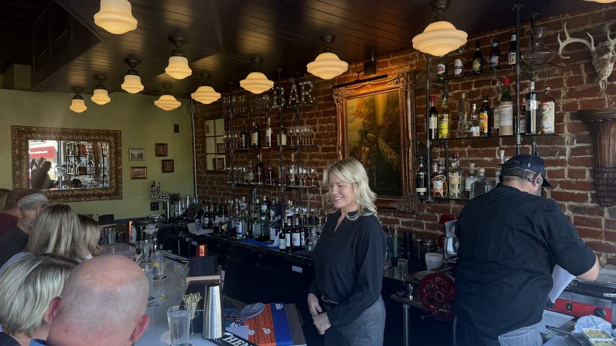 Customers at The Parker Hollow in downtown Parkville sit at the bar.