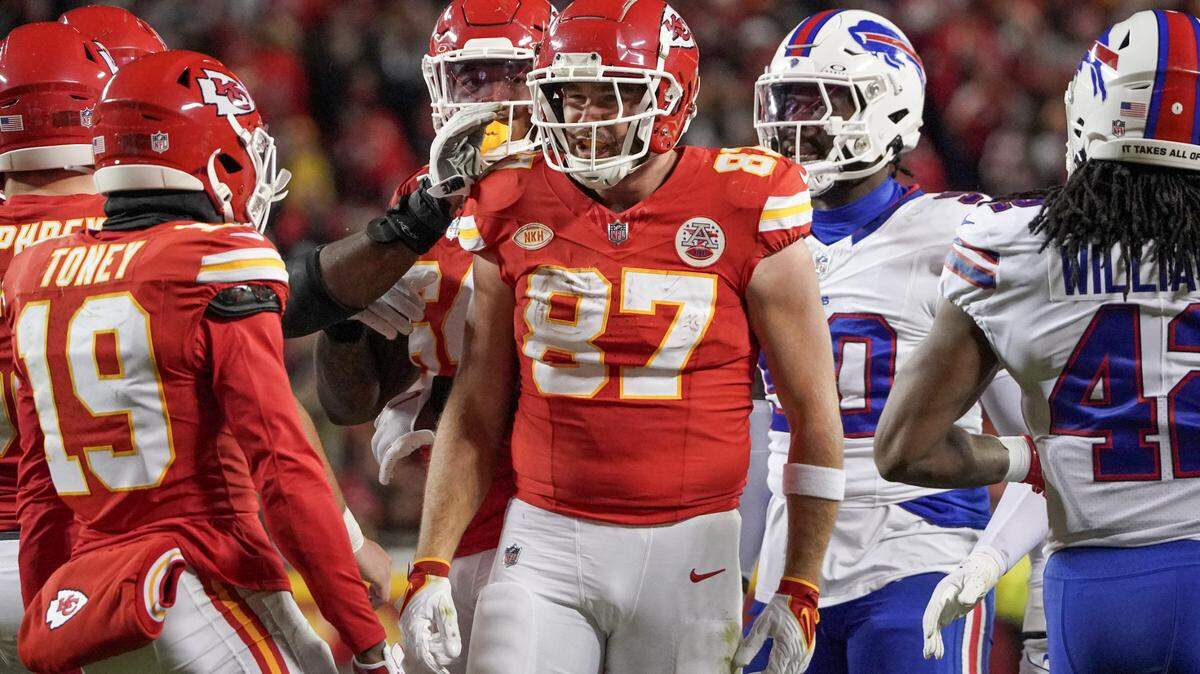 Kansas City Chiefs tight end Travis Kelce (87) celebrates with wide receiver Kadarius Toney (19) after a play against the Buffalo Bills during the second half at GEHA Field at Arrowhead Stadium.