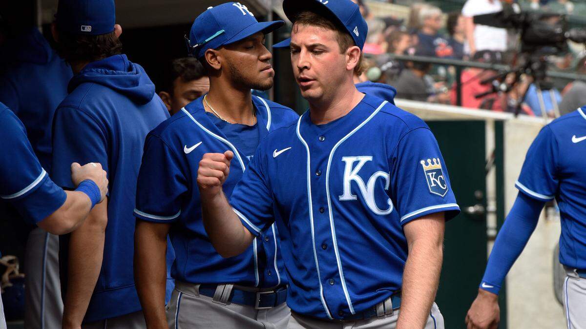 Kansas City Royals starting pitcher Kris Bubic, foreground, is congratulated in the dugout after the final out of the seventh inning of a baseball game against the Detroit Tigers, Sunday, Sept. 26, 2021, in Detroit. (AP Photo/Jose Juarez)