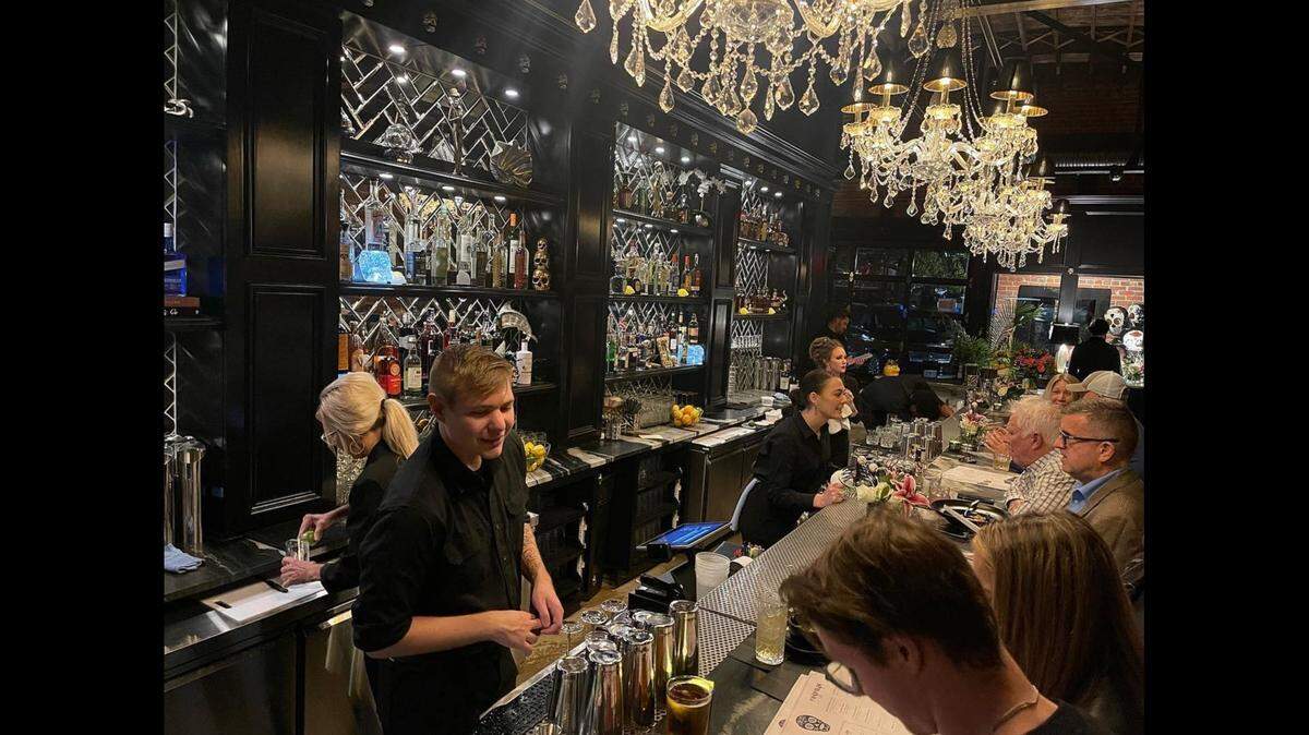 Calavera’s has a sophisticated Day of the Dead theme featuring black, white and silver decor, as well as crystal chandeliers and decorative skulls
