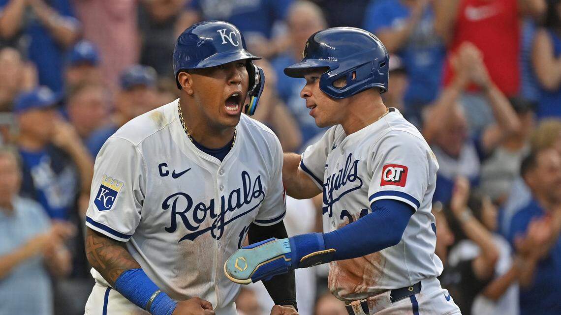 Kansas City Royals catcher Freddy Fermin (34) and Salvador Perez (13) react after scoring in the sixth inning against the Chicago Cubs at Kauffman Stadium.