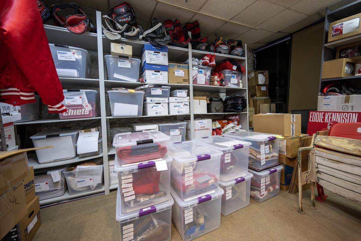 A collection of Kansas City Chiefs artifacts, including uniforms, shoulder pads, jackets and case files, is stored in the Artifact Room inside the team’s underground storage facility in Kansas City.